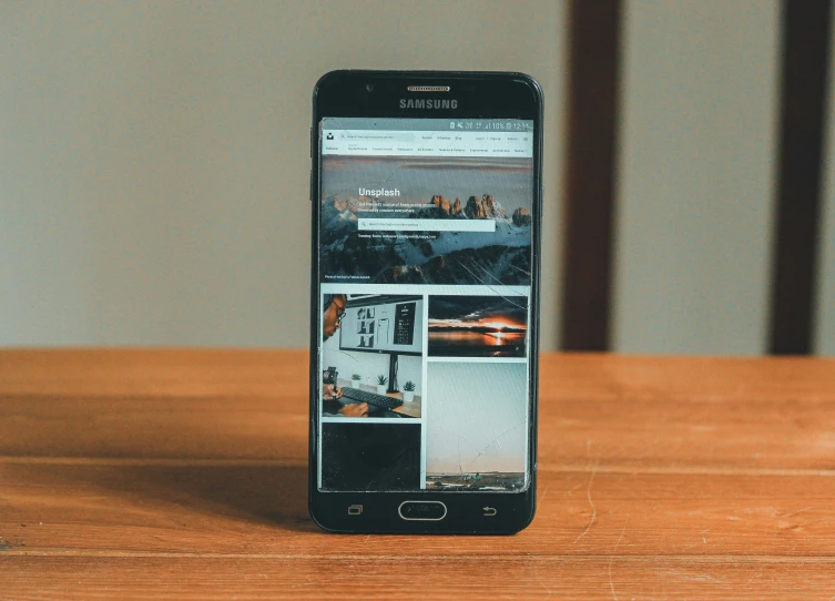 a mobile phone sits on top of a table