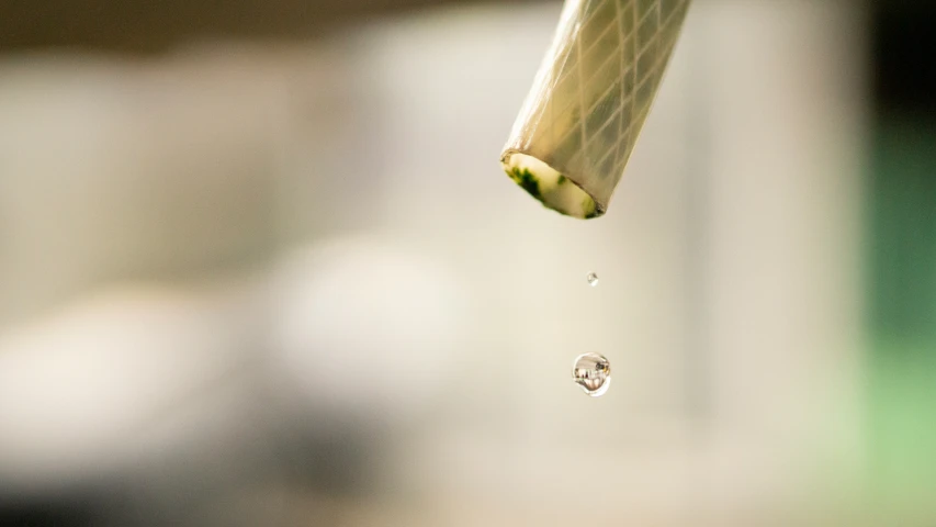 the drop of water that is attached to a faucet