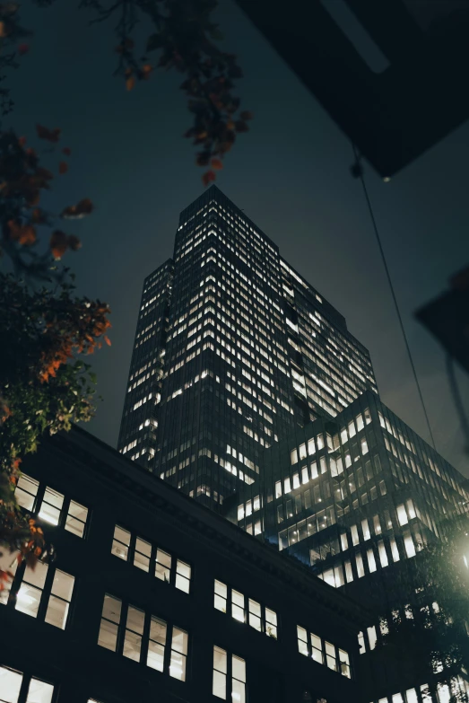 the outside view of an office building lit up at night