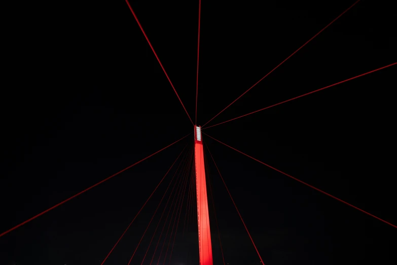 a large red and white tower with a clock