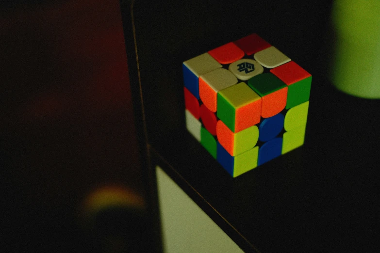 rubrique cube placed upside down on a shelf