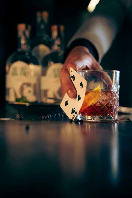 a person taking ace and a glass with alcohol