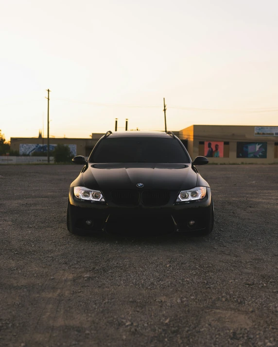 a black car parked in front of a building