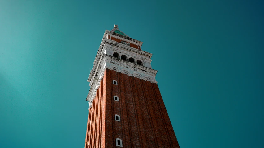 there is a clock that says time at the top of this tower