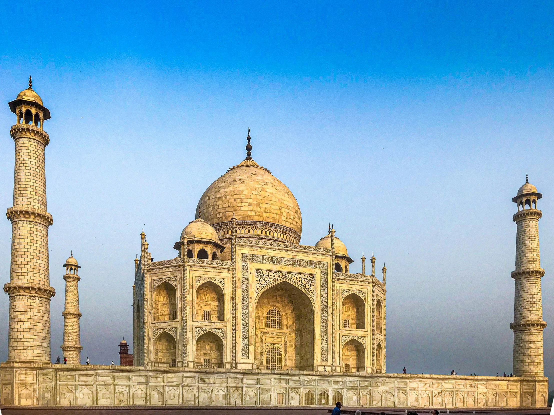 an ornate, historical building surrounded by a large river