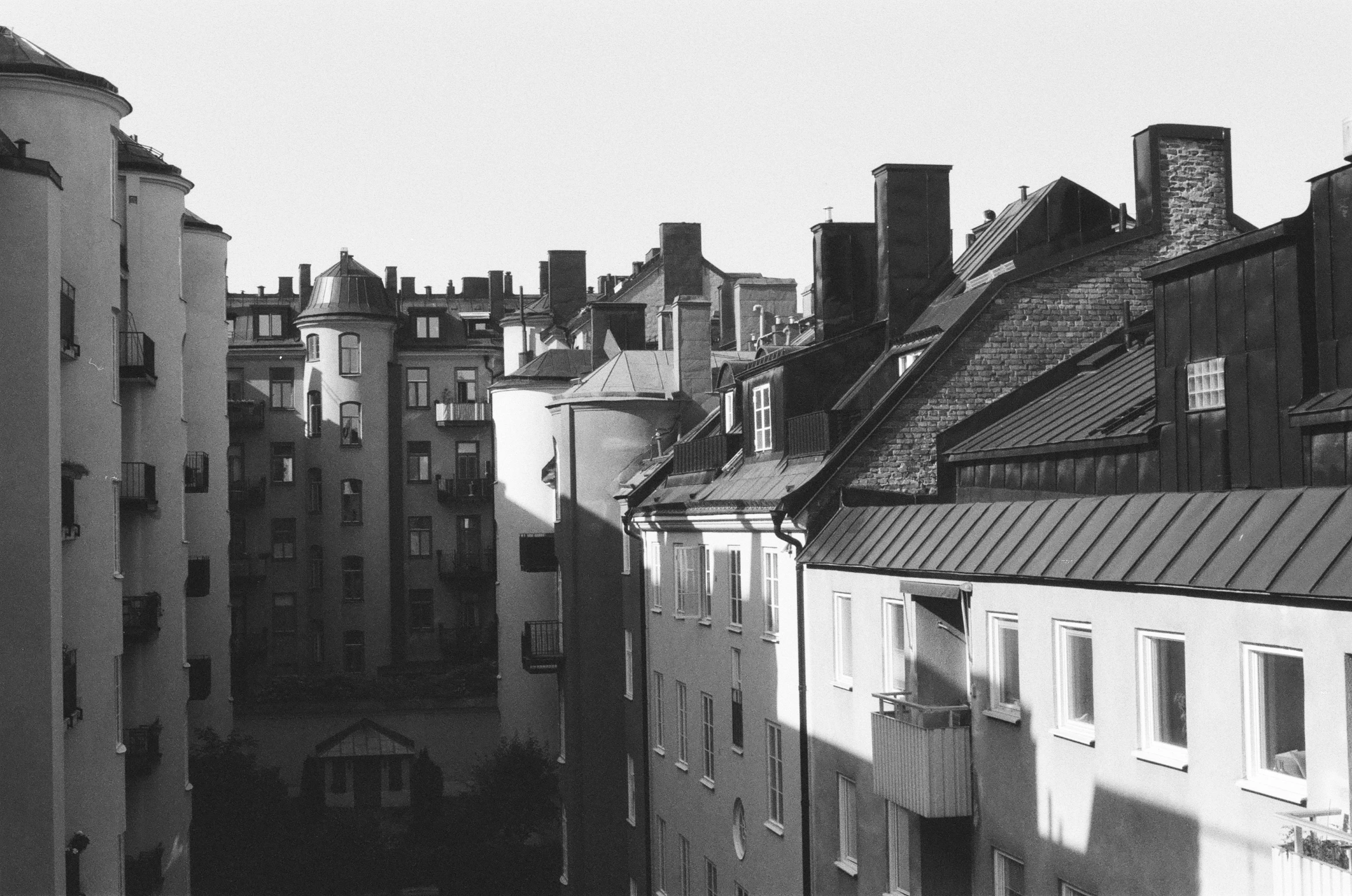 the shadows of buildings are casting on a sunny day