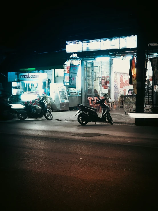 there is a motorcycle parked on the street near an older building