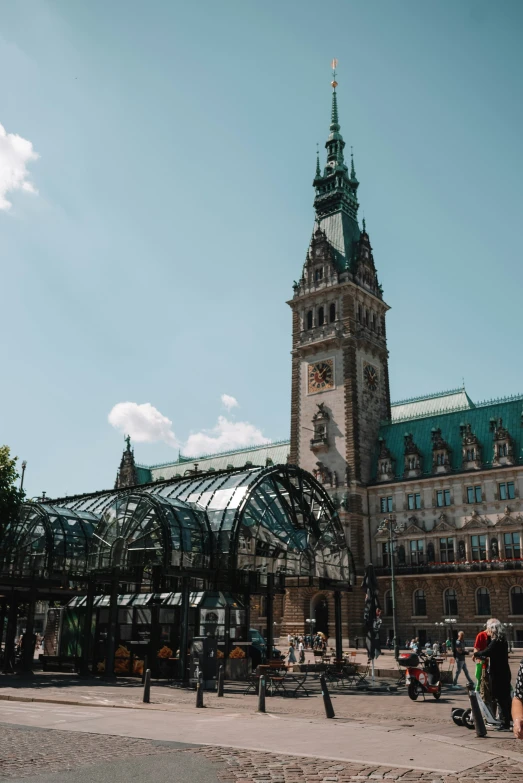 a tall clock tower sitting next to a clock tower