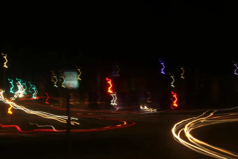 night time view of a city street lit up with lights