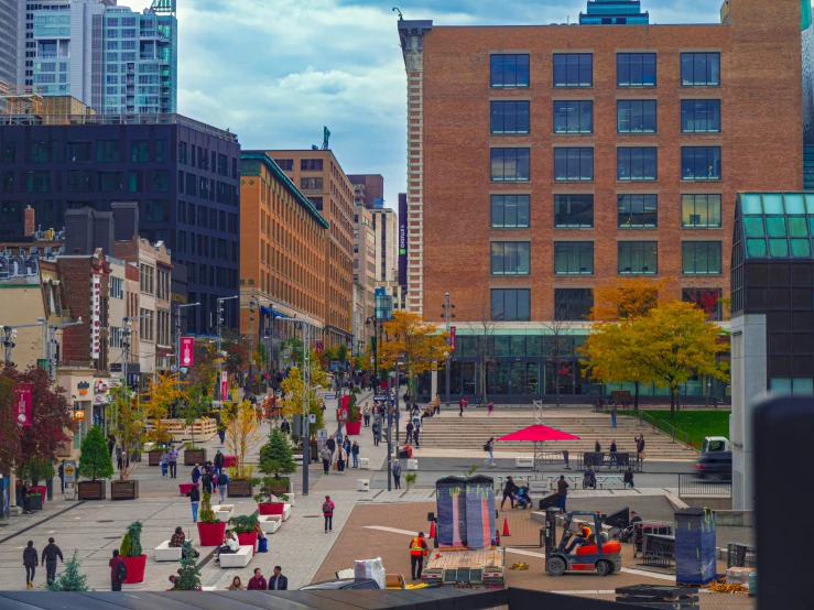 a street with some cars, and people walking around