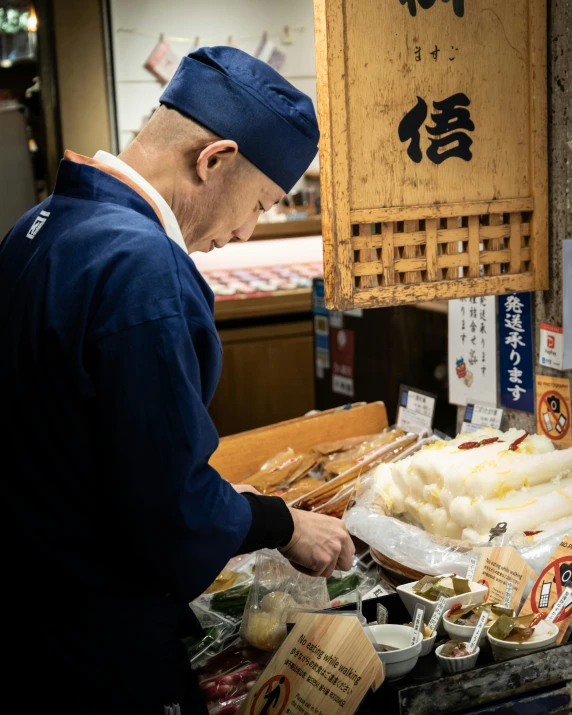 man in blue uniform holding bag and preparing food