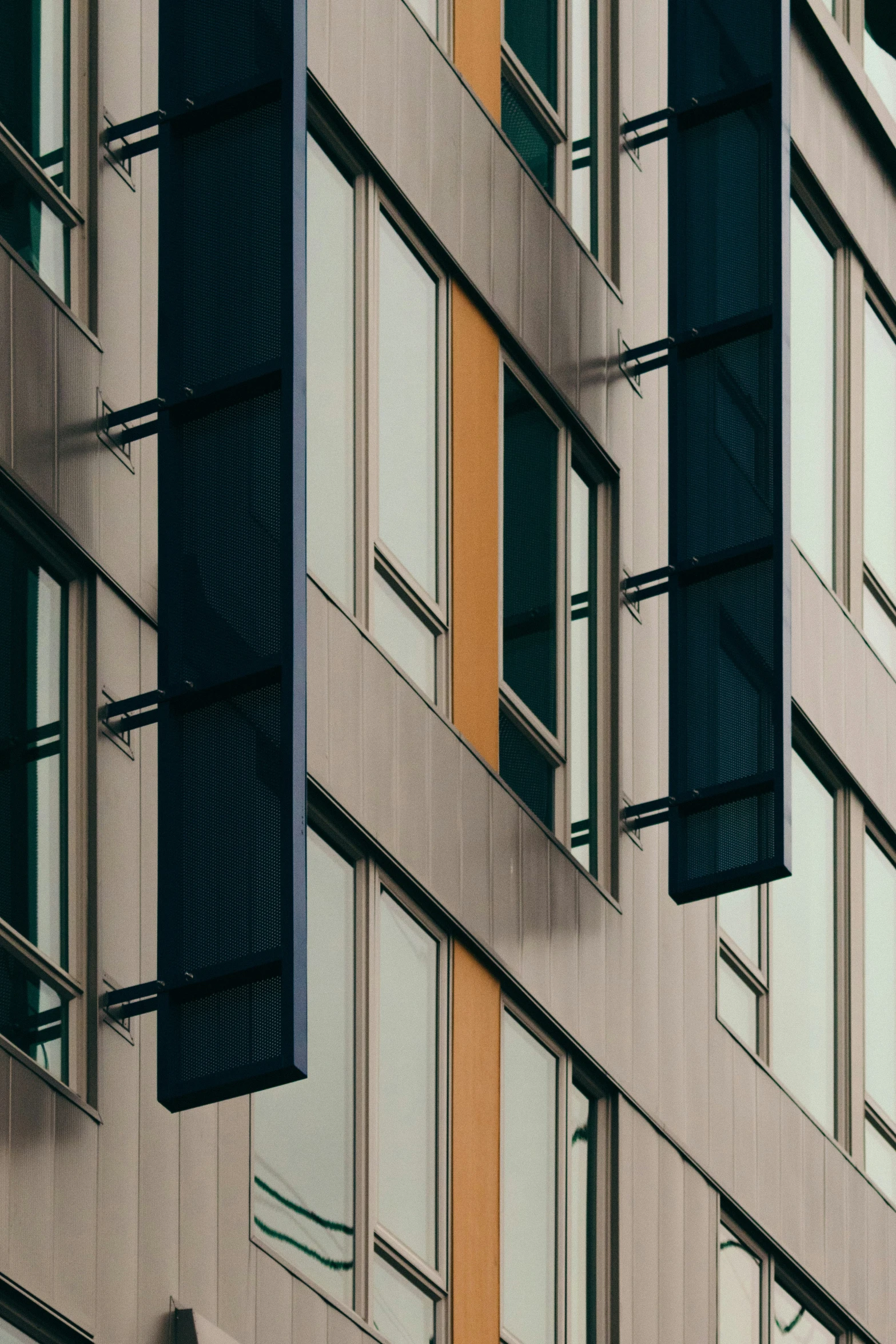 the exterior of a tall building with windows