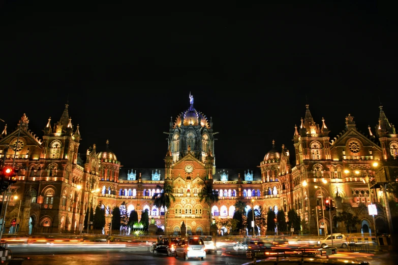 the night skyline features some very ornate buildings