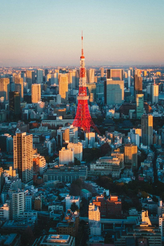 a city with tall buildings and a red tower