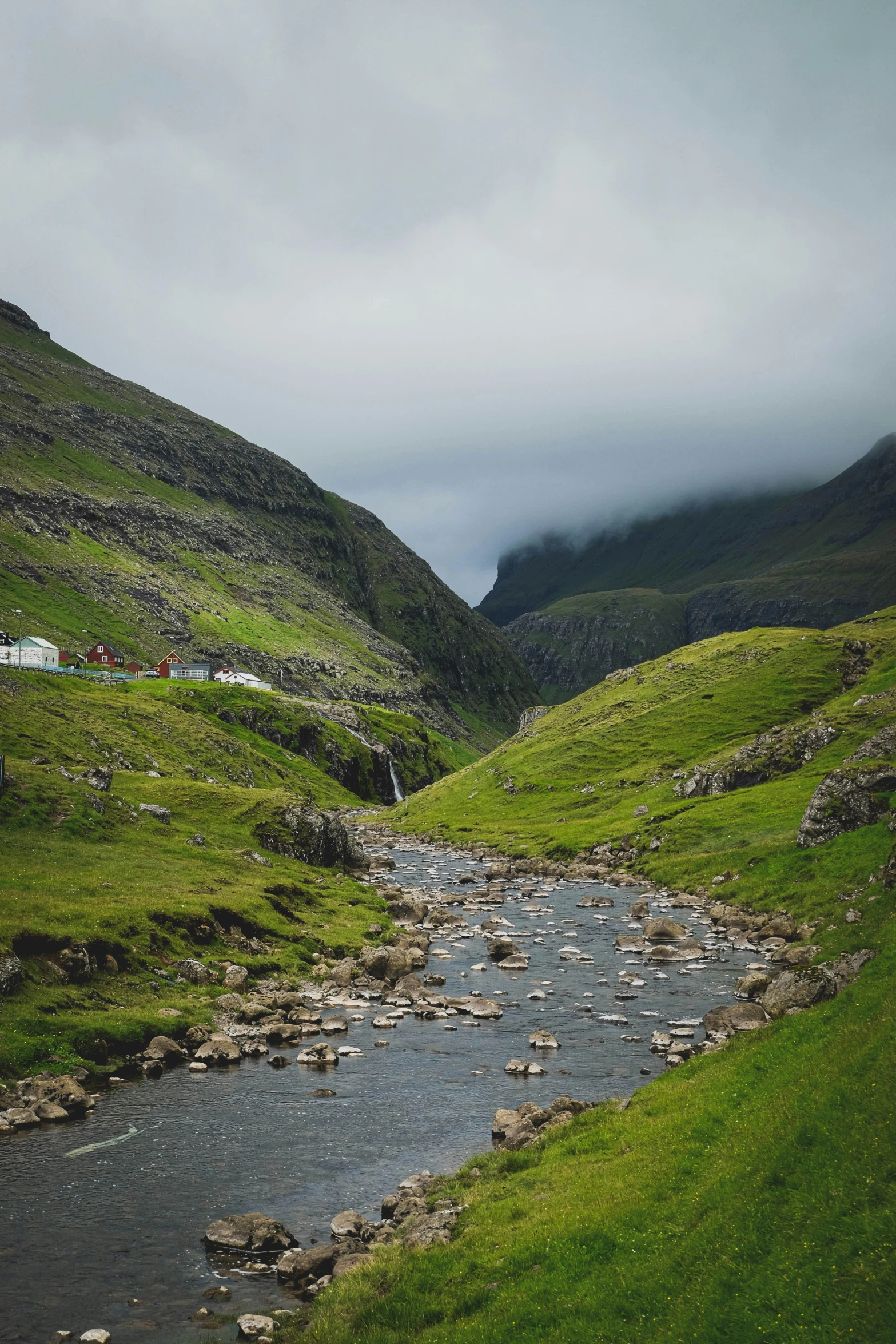 a small stream is running down the side of a hill