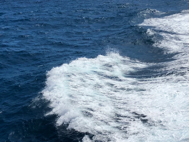 the back of an ocean ship with very little waves