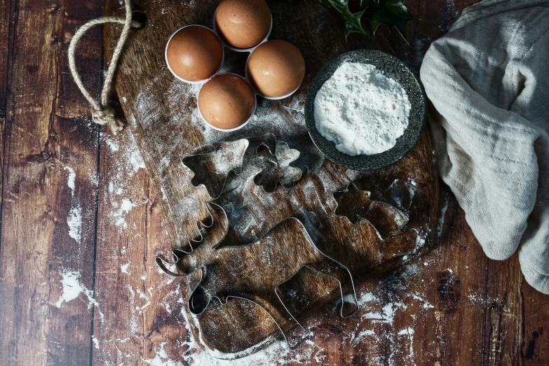 some food is sitting on the floor on top of some flour