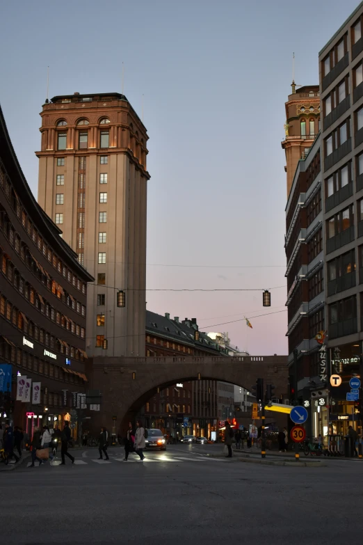 a busy street in a large city at dusk