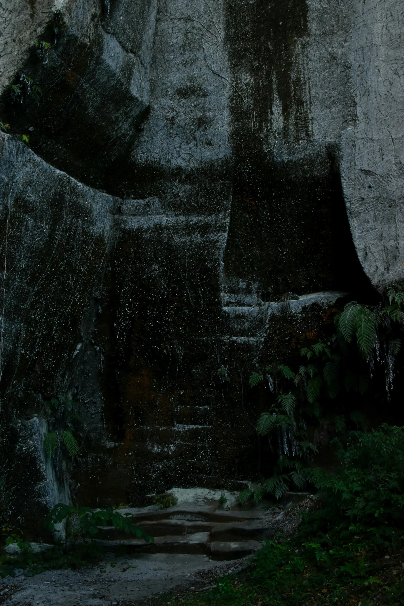 rain is falling down over a rock formation