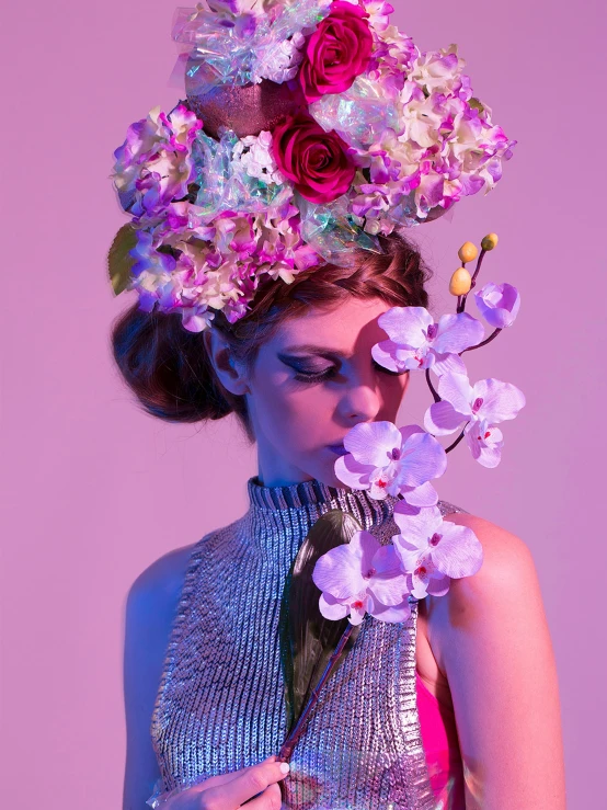 a woman with florals on her hair and neck