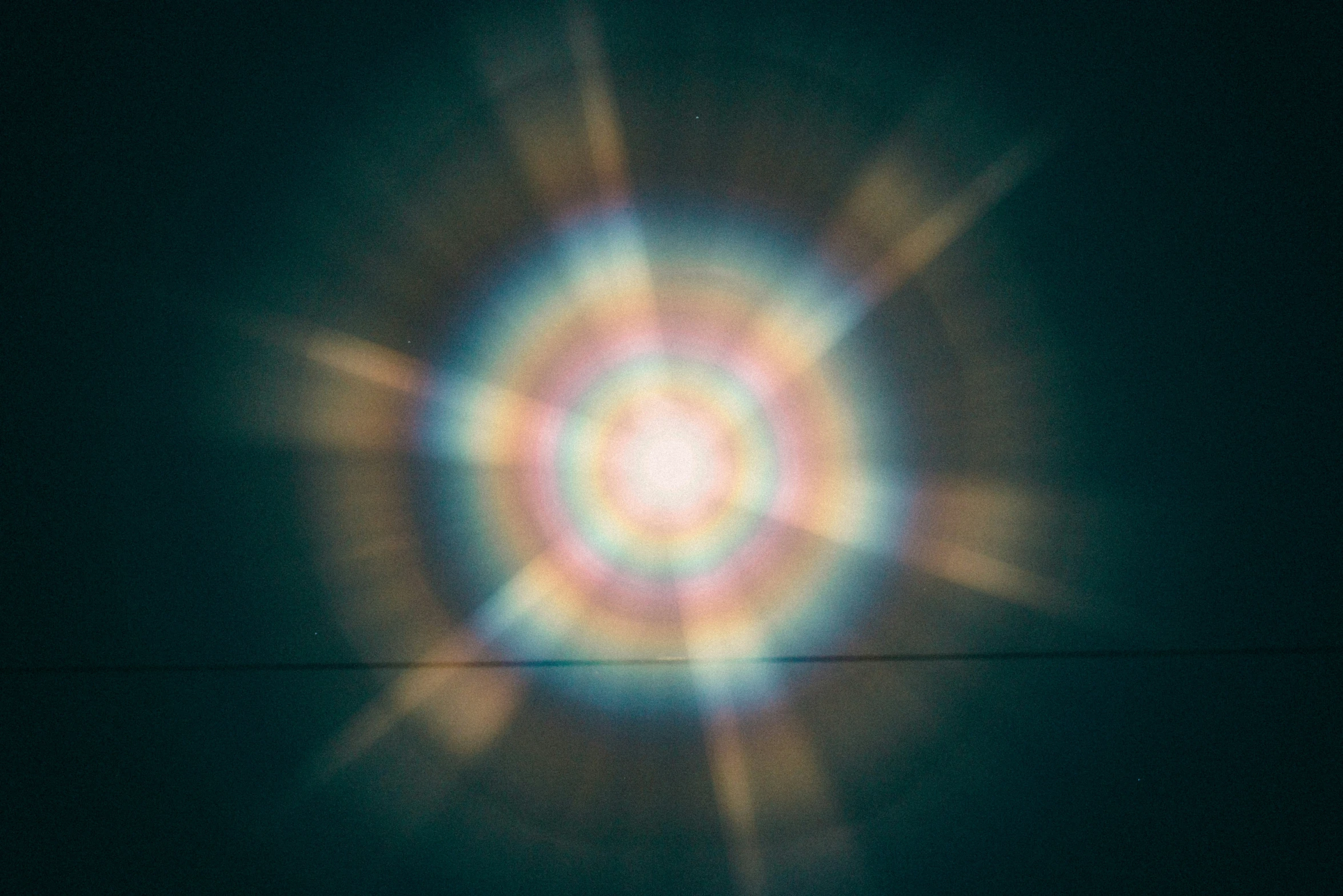 an eye image that is being projected on the dark background