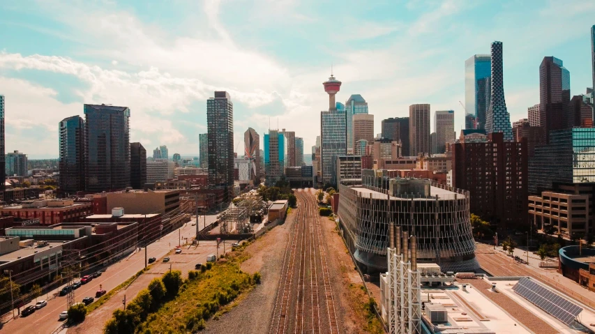 a train track in front of a city skyline