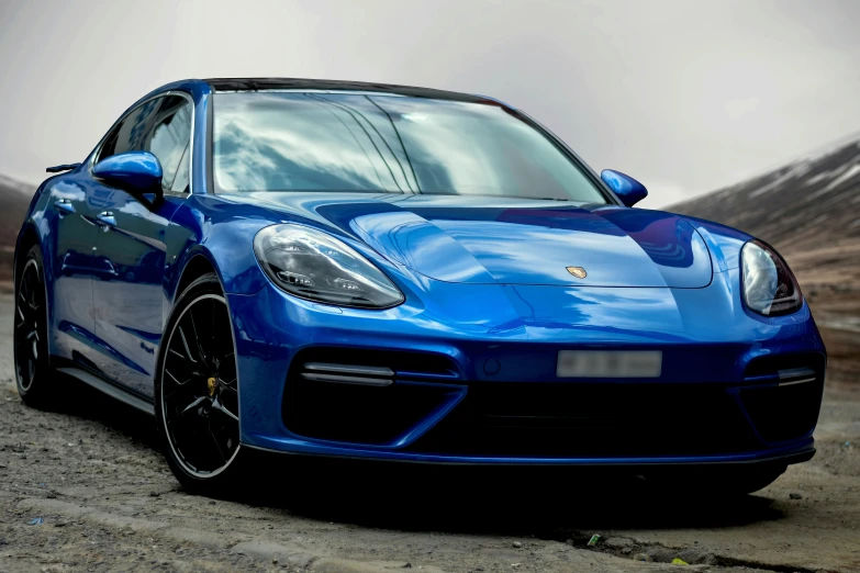 the new porsche 711 gtr sits on a gravel road