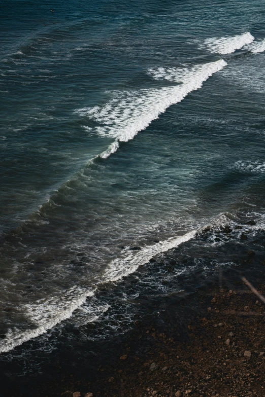 the water is coming in to shore as we walk along the shore line