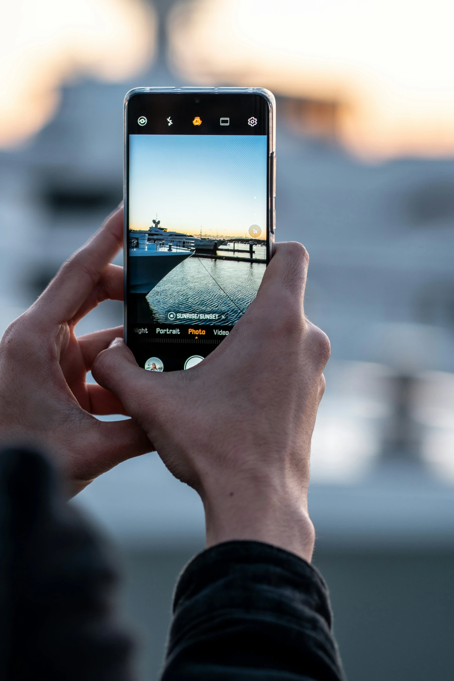 a person holds a phone up to take a picture