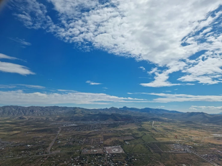 an aerial view of an urban area under clouds