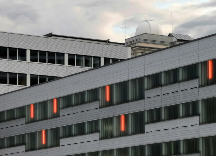 the back of an office building with orange windows