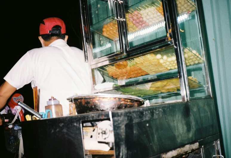 a man standing in front of a store case