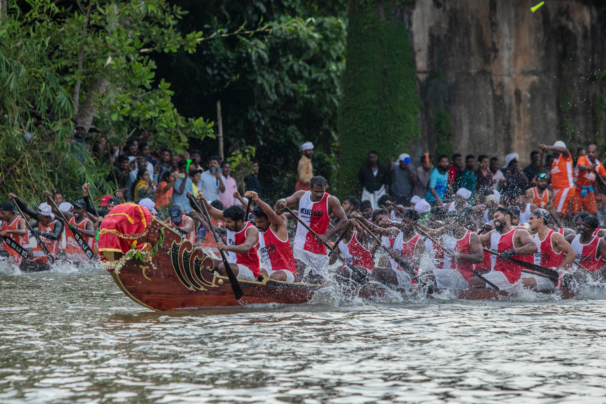 people are in their canoes and a man is taking off