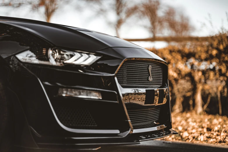 a black car is shown with the grill grills on