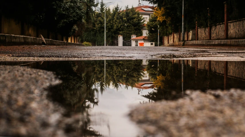 a small pond with a house in it