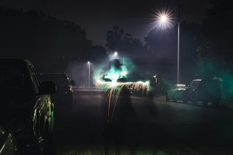 a truck driving down a dark city street at night