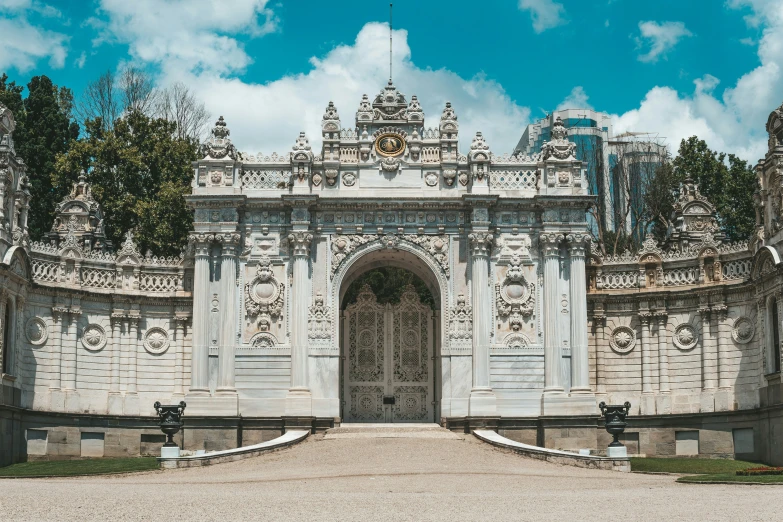 a stone and stone arch with clock on top