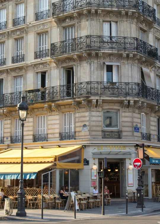 a city square with an old building and store fronts