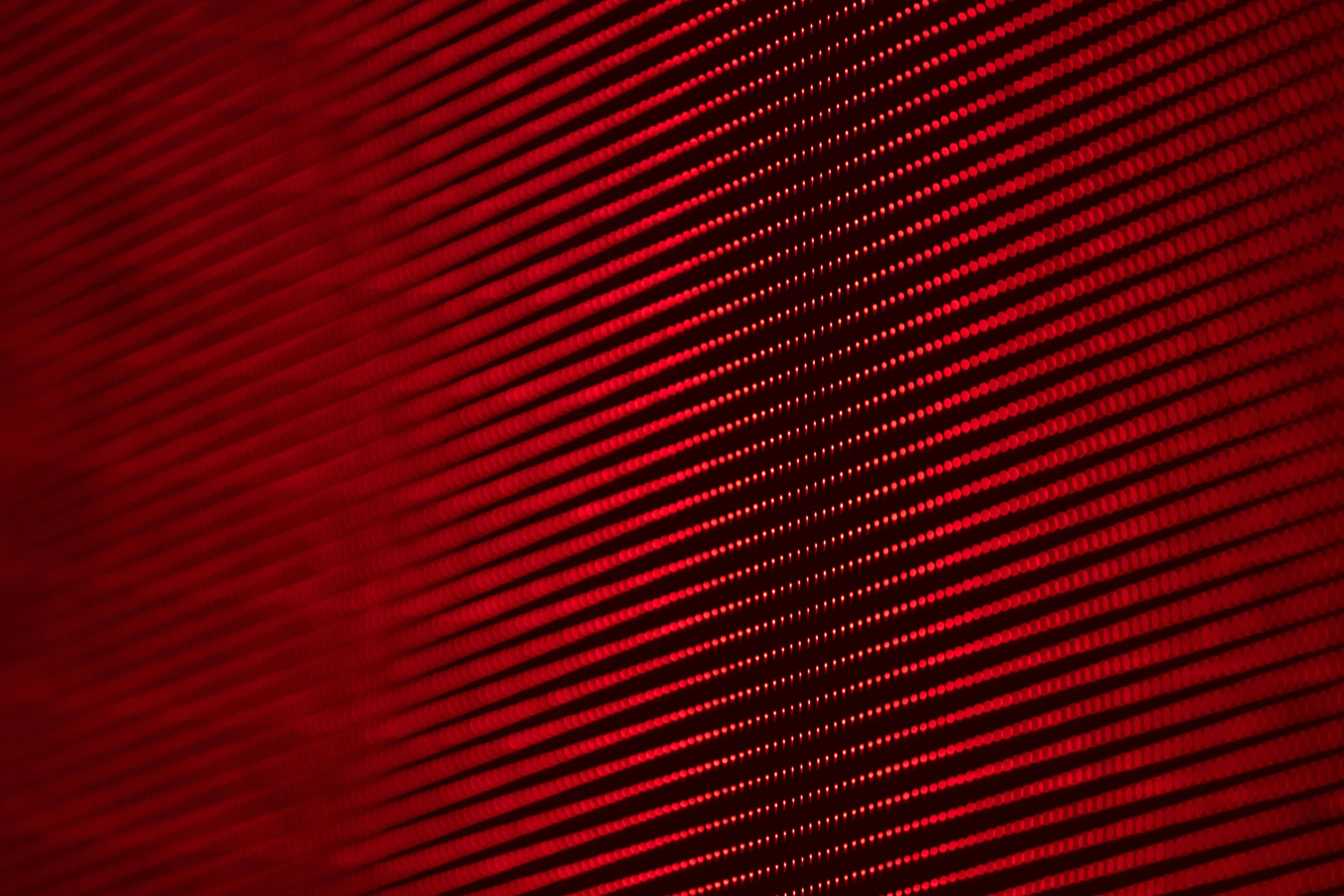 a po of red lines with a dark background