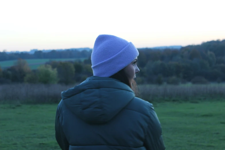 a person is standing outside in a field