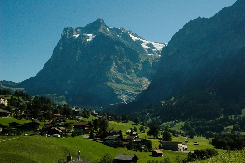 a beautiful mountain view with a village below