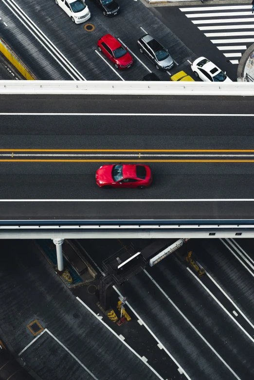 a view from above of an intersection with cars on it