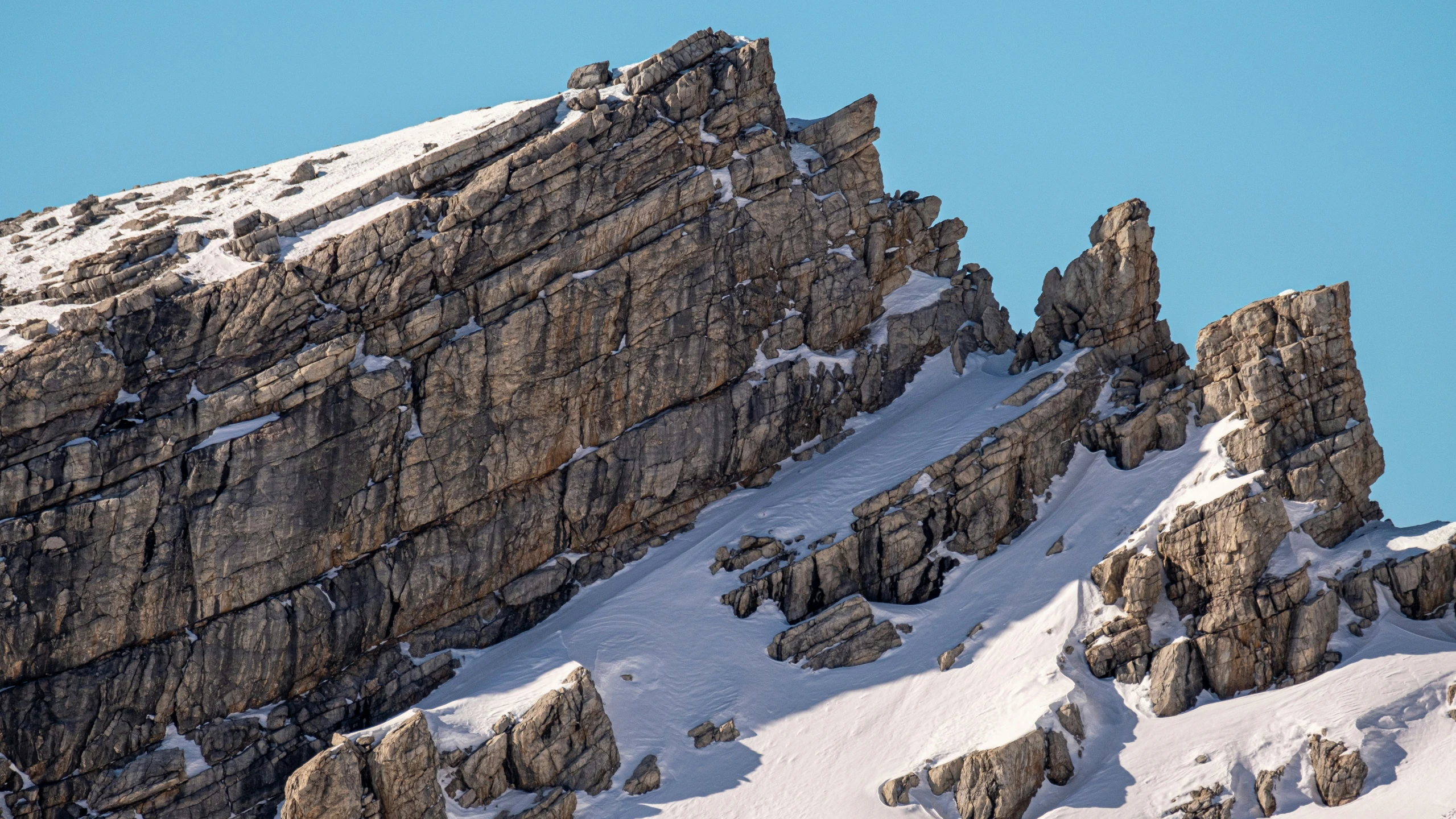 the snowy mountains are very high with ice