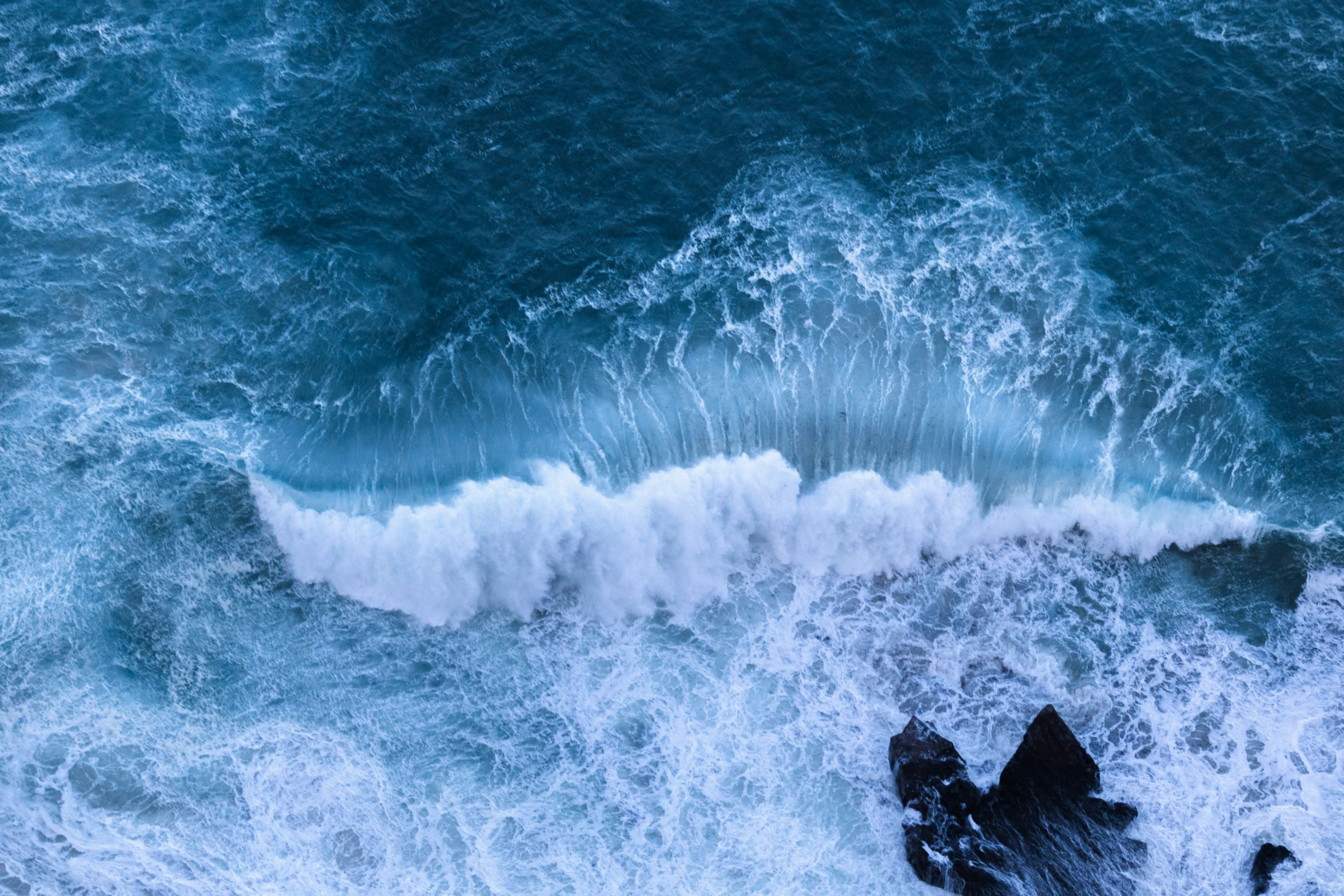 an ocean filled with water and crashing waves