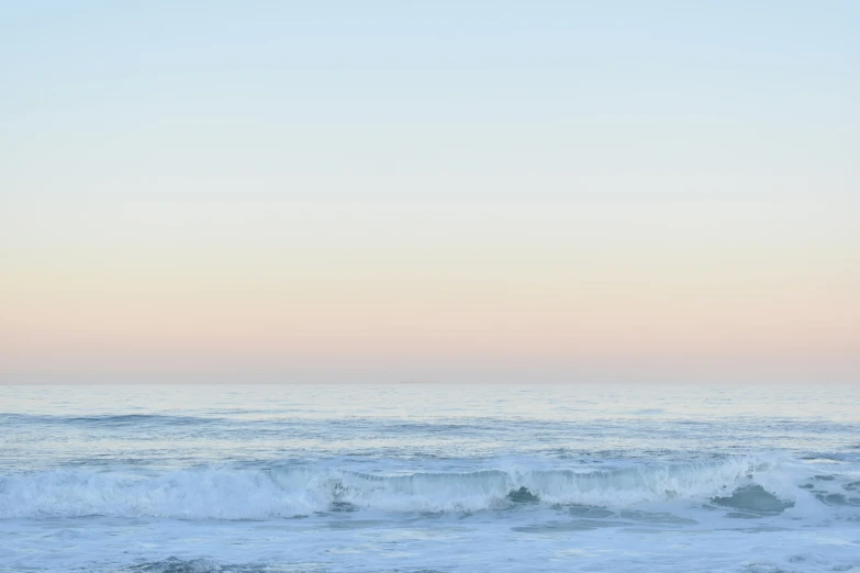 a person riding a surfboard in the ocean