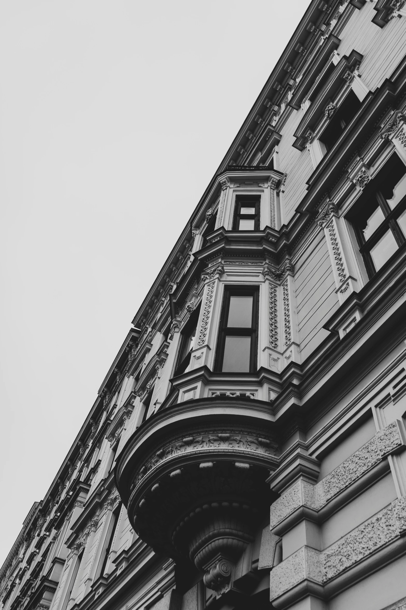 a tall building sitting under a white sky