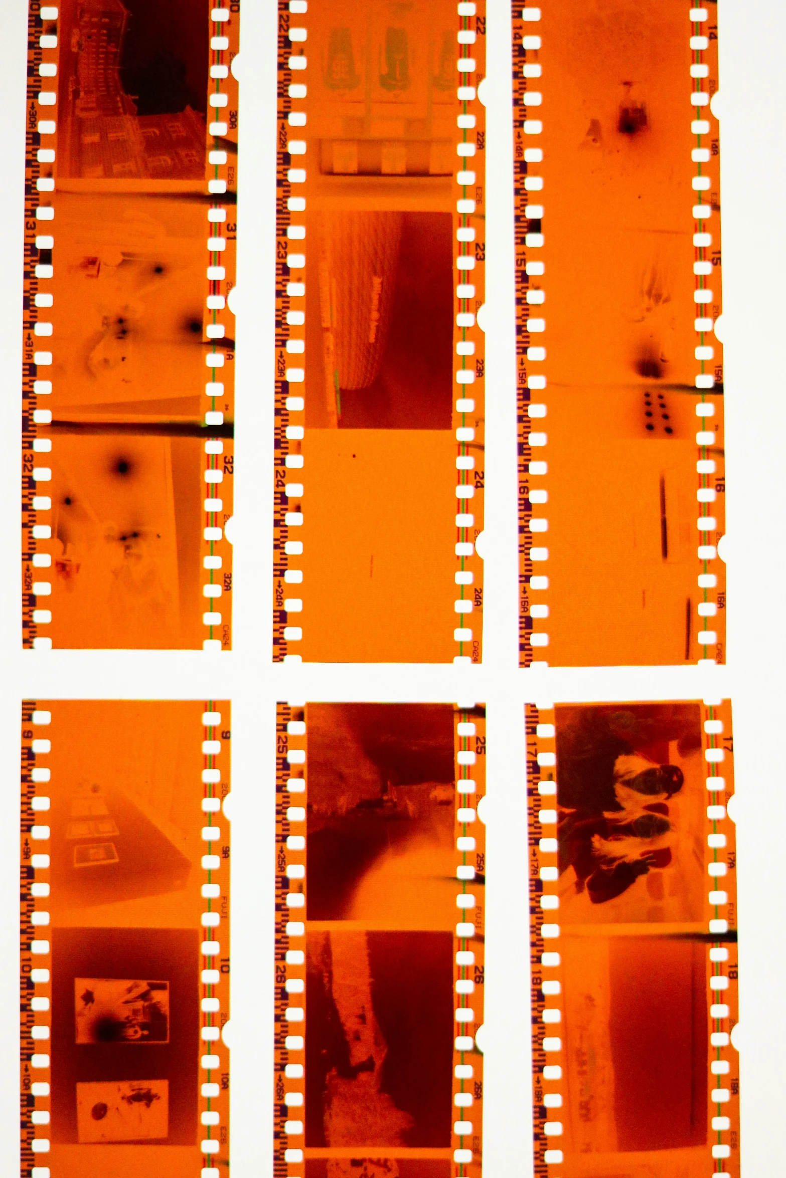 multiple old movie film strips with one orange blurry