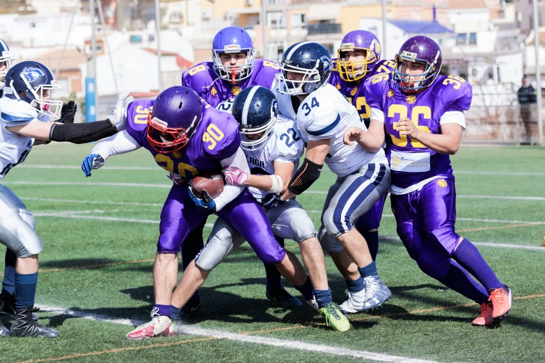 a game of football is being played as a team