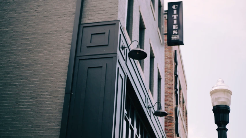 an old fashion building has a white lamp next to it