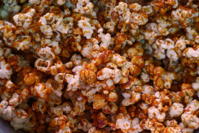 popcorn sprinkled and filled with orange, white and brown flakes